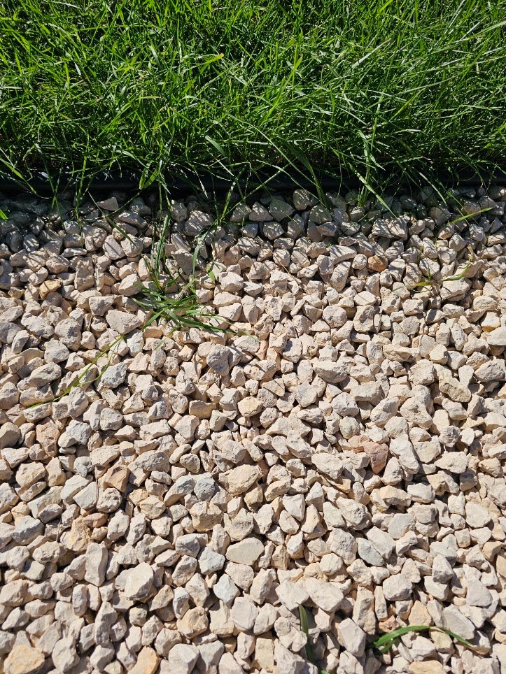 How to stop weeds in gravel along lawn borders and rock pathways